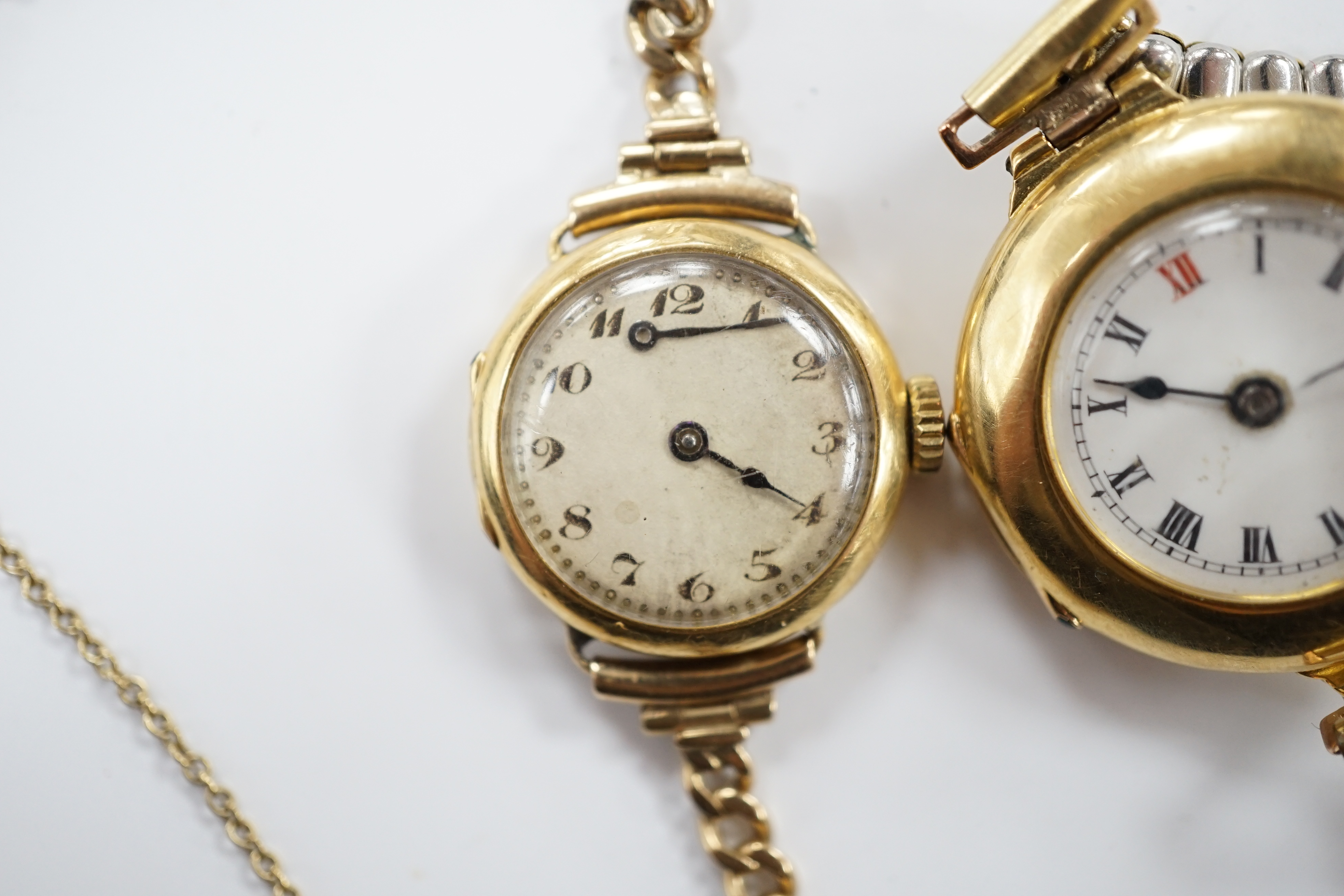 A lady's early to mid 20th century 18ct gold manual wind wrist watch on a 9ct bracelet, together with one other similar 18ct gold manual wrist watch, on a flexible gold plated flexible bracelet.